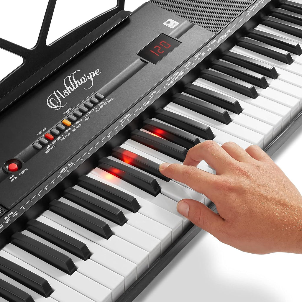 61-Key Digital Electronic Keyboard Piano with Light Up Keys, Stand, Bench, Headphones, Mic and Keynote Stickers M838559